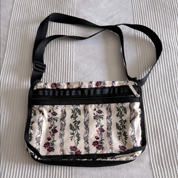 Lesportsac Handbags - Lesportsac Floral Black and Cream Crossbody Bag With Zip Pouch